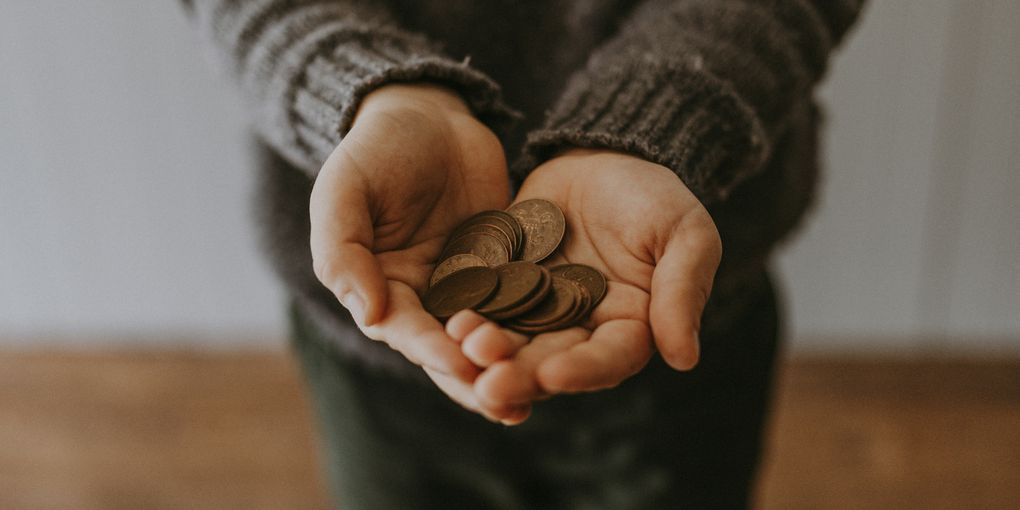 Hand with coins